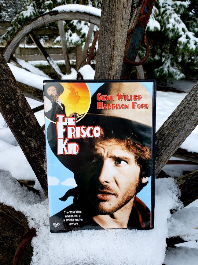 photo of the Frisco Kid dvd on a snow-covered wooden wheel
