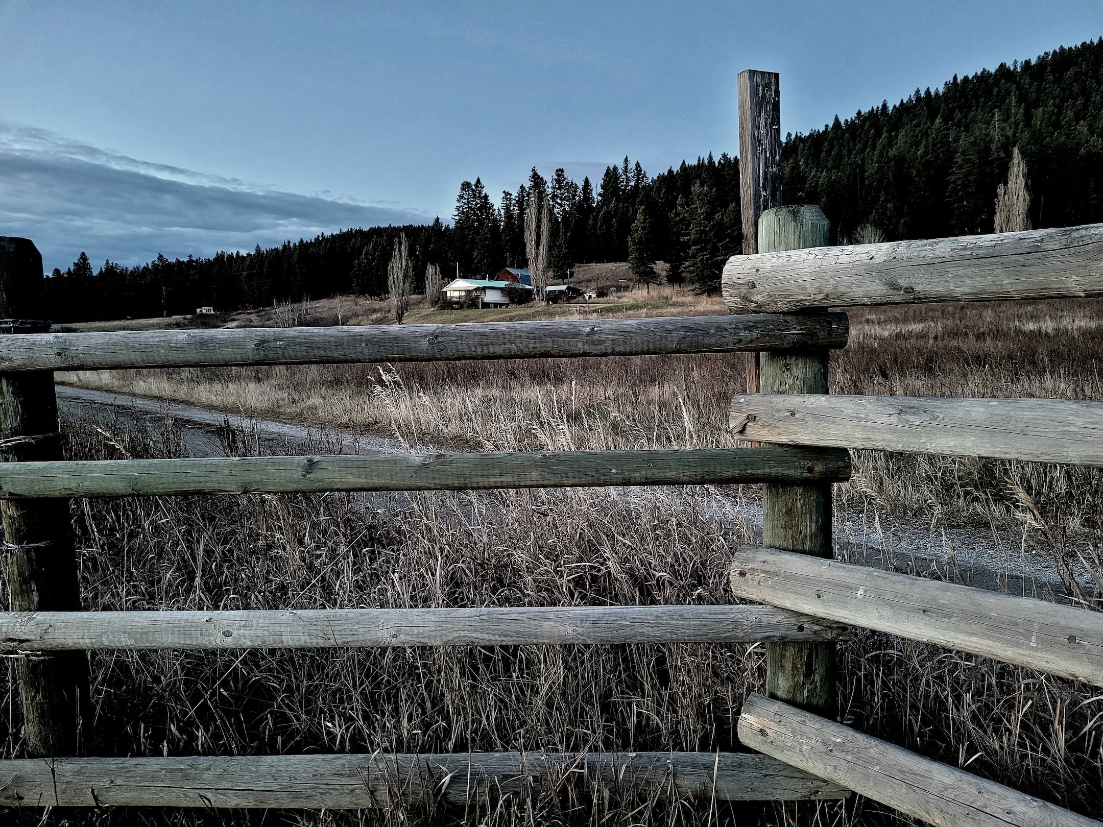 photo of a wooden ranch fence at twilight