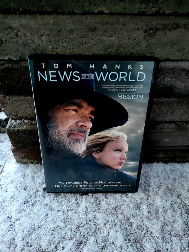 photo of the News of the World DVD resting in snow