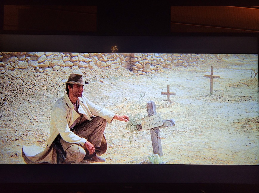 photo of the scene in which Nobody is crouched at a tombstone
