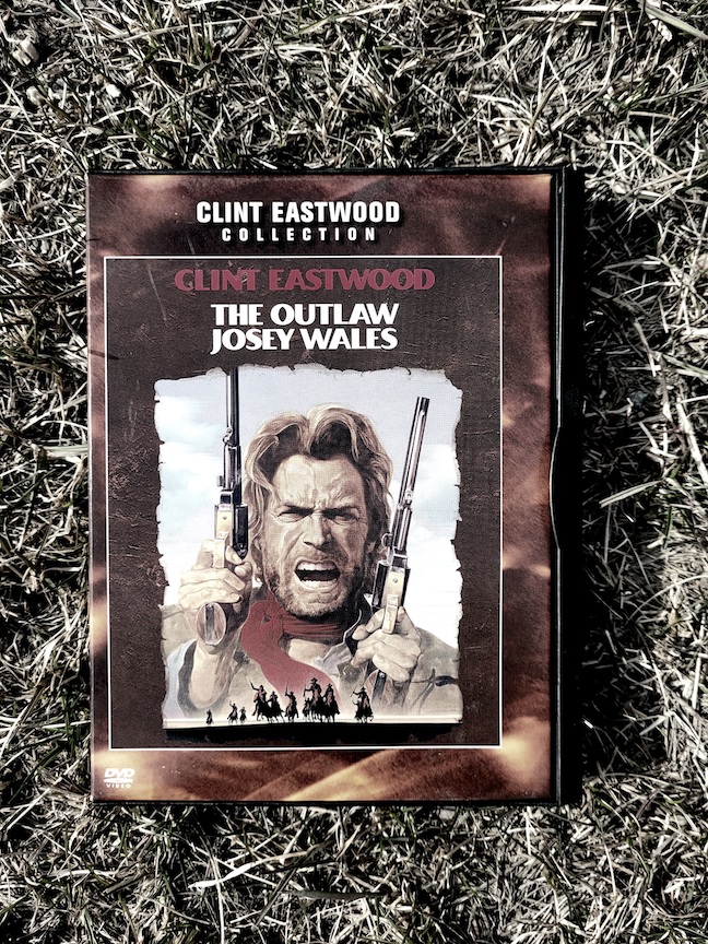 a photo of The Outlaw Josey Wales DVD lying in grass