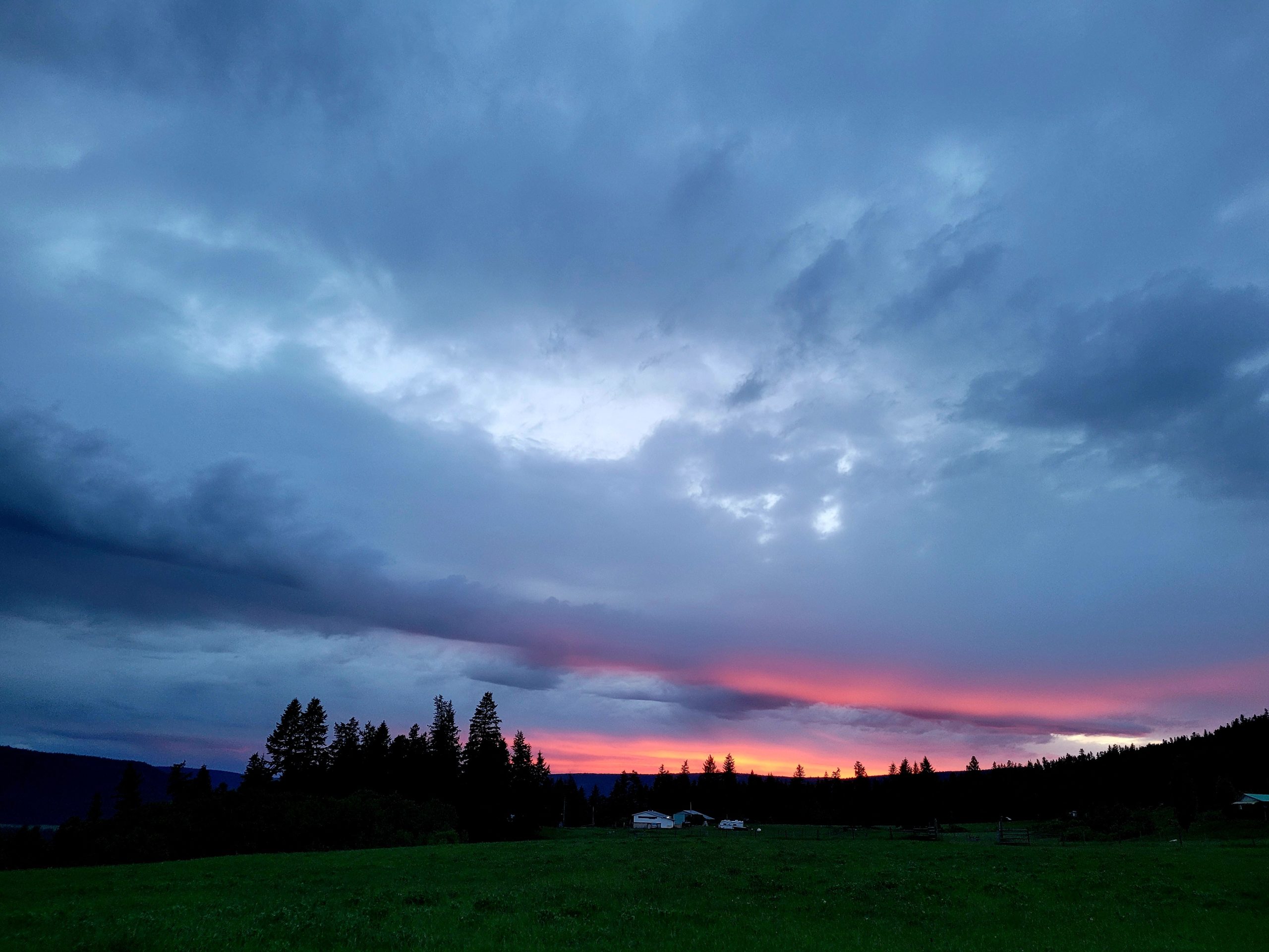 dark sunset over a ranch