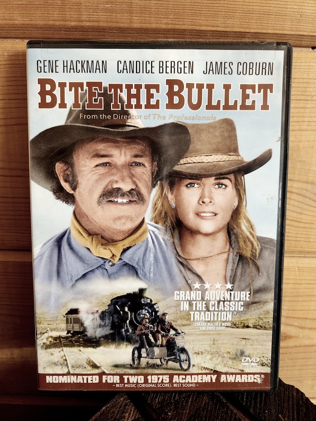 photo of the bite the bullet DVD against a wooden wall panel