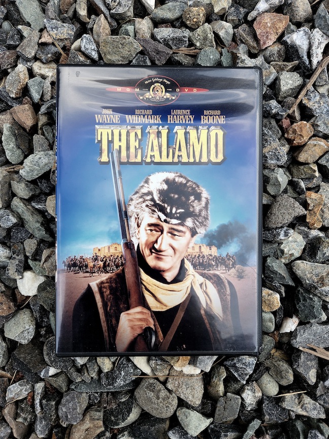 photo of the Alamo DVD against gravel