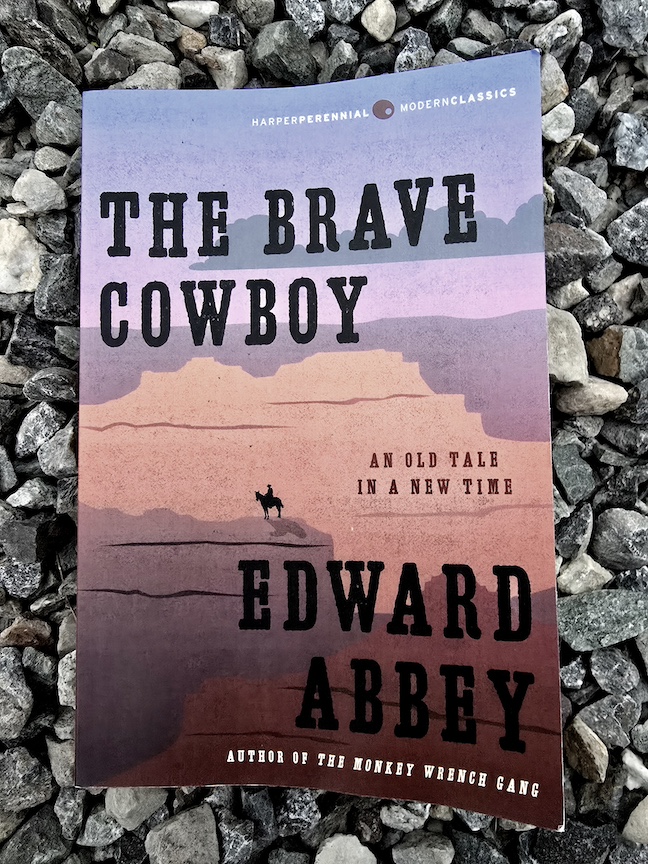 photo of the brave cowboy paperback against large gravel
