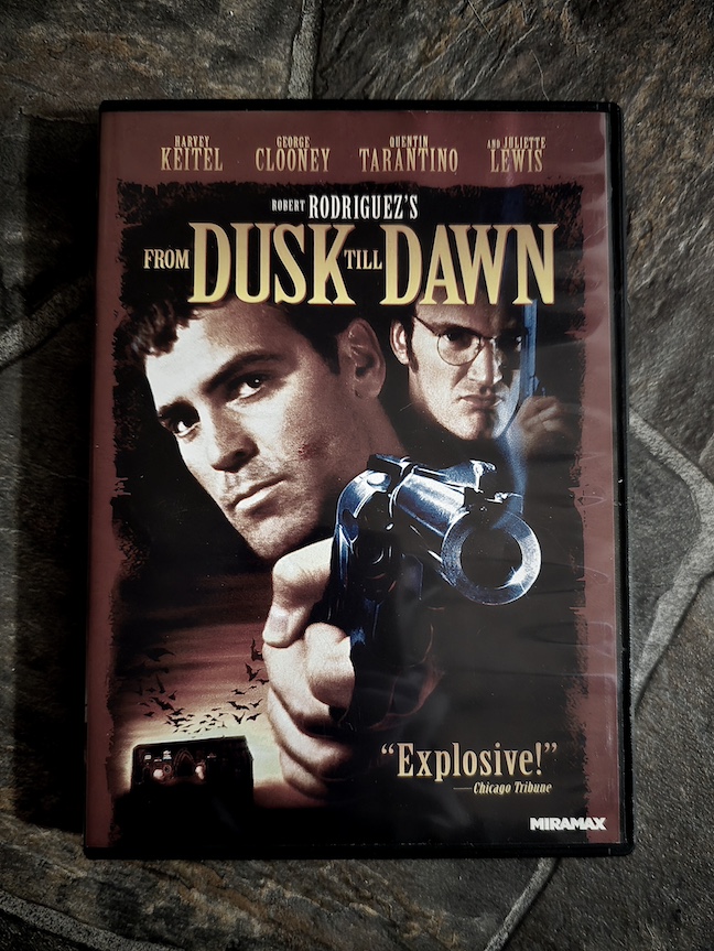 photo of the from dusk till dawn dvd on a dark grey rock-like background